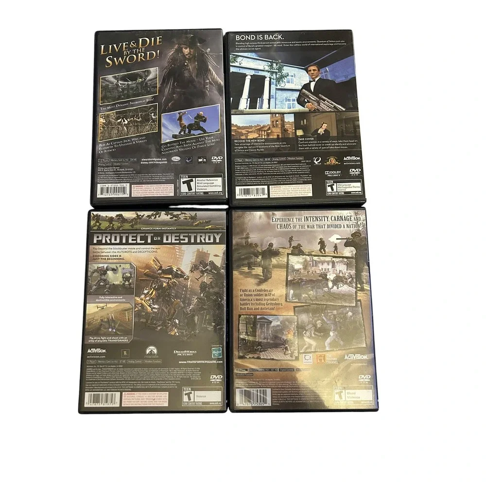 PS2 Action Game Lot (4 Titles) - 007 Quantum Solace, Transformers, Pirates CIB